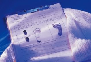 Newborn birth certificate with footprints and fingerprints — NRIWAY Birth Certificate Attestation Services.
